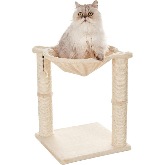 Fluffy cat sitting in elevated plush hammock on cat tree