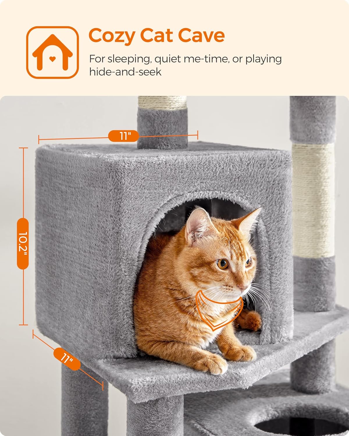 Close-up of a cozy cat condo with a cat resting inside