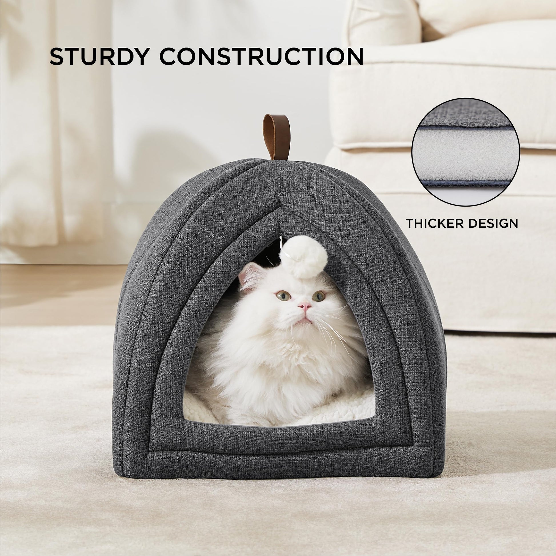 White cat in foldable cat cave with sturdy construction.it has thicker design
