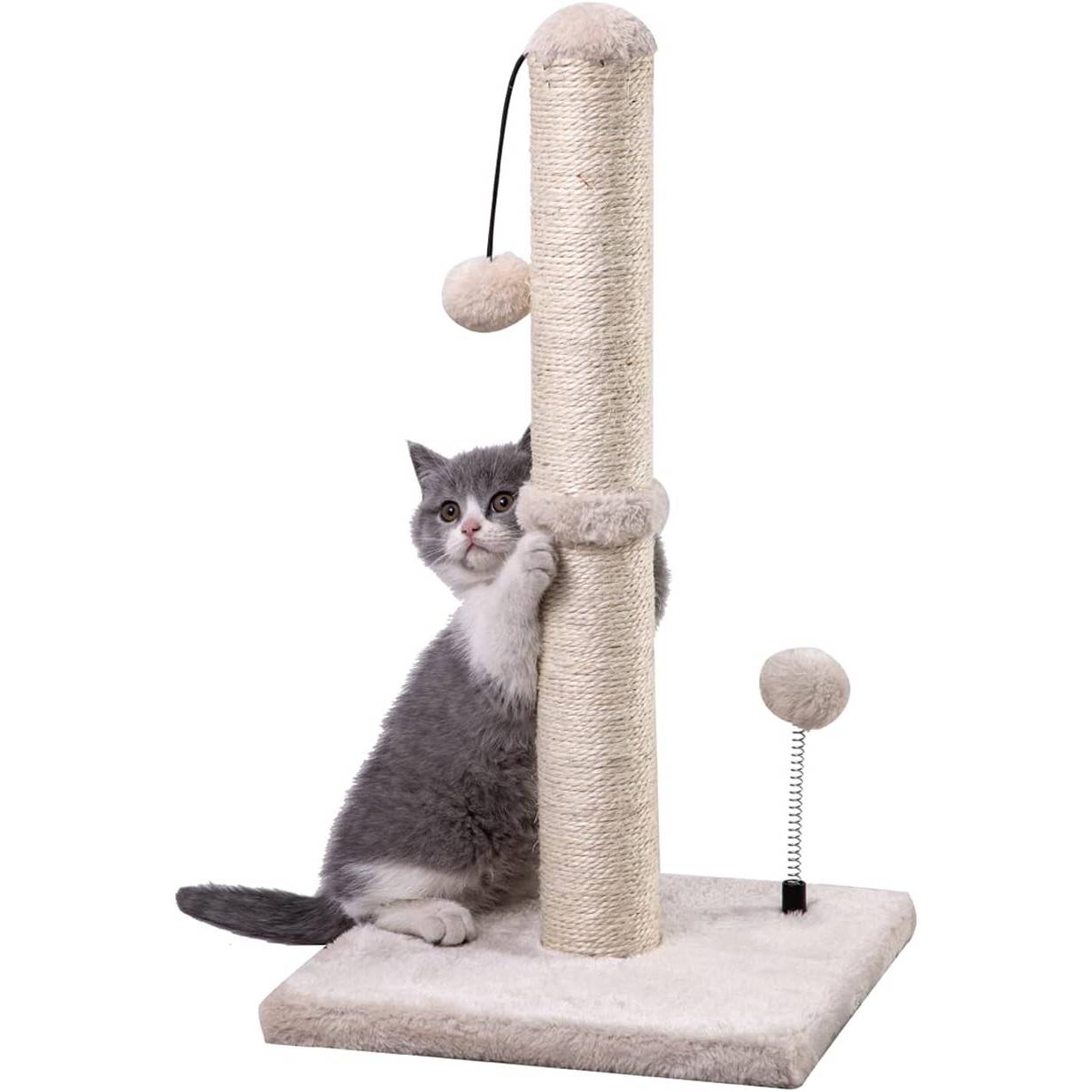 Gray kitten hugging a sisal cat scratching post with hanging plush ball toy