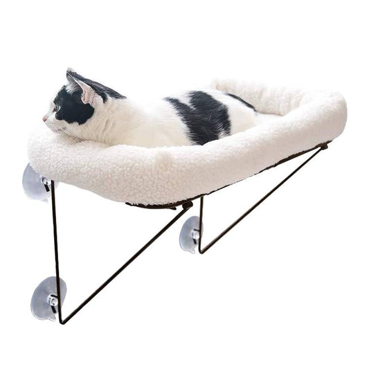 Cat relaxing on sturdy window hammock bed with suction cups