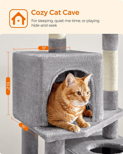 Close-up of a cozy cat condo with a cat resting inside