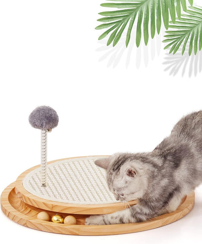Kitten playing with interactive sisal cat scratcher and track ball